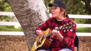 John Fogerty sings Lookin' Out my Back Door from his home.