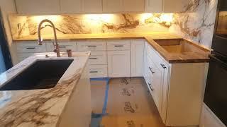 I finished installed A beautiful marble Island and kitchen backsplash