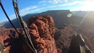 Flying paragliders over desert towers