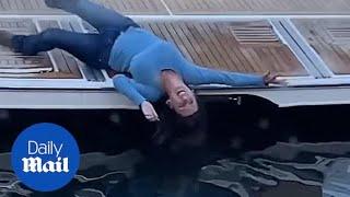 Drunk woman stumbles from docked boat into water in hilarious footage