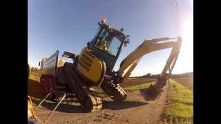 Yanmar mini excavator climbing truck fast.