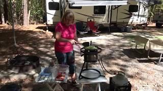Getting philly cheese steaks ready using the outdoor cooker