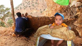 The life of an Iranian nomadic father with his baby in the mountains