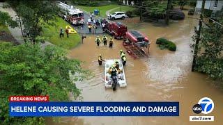 Catastrophic flooding from Hurricane Helene forces people to seek safety on rooftops