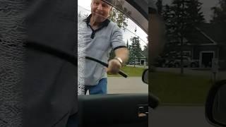 Karen smashes window