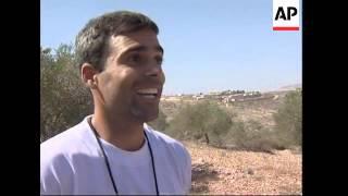 Israeli peace activists help Palestinians with harvest