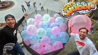 TRAMPOLIINE FILLED WITH WUBBLE BUBBLES! (COMPLETELY FULL)