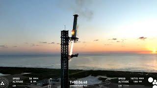 In a first, SpaceX 'catches' megarocket booster after test flight | AFP