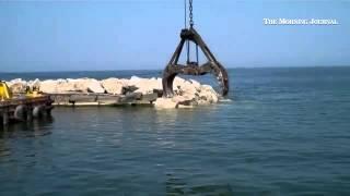 Check out these views of Geo. Gradel Co. working on #Lorain outer breakwall off the Mile Long Pier.