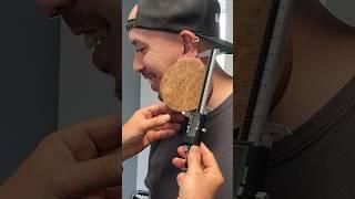 Largest earlobe flesh tunnel - 11.48 cm (4.51 in) achieved by Marc Greenleaf 