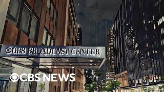 A rainy night in 1970s New York with Walter Cronkite's "CBS Evening News" playing in another room