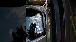Political Statements: Stickers and Flags Supporting Controversial Figure