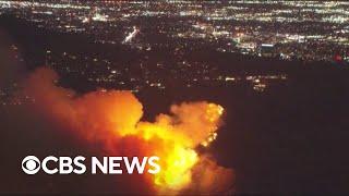 Aerial footage of California fires shows rapid expansion of blazes