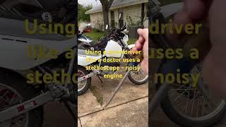 Using a screwdriver, like a doctor, uses a stethoscope on a motorcycle￼