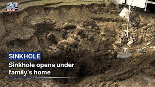 Sinkhole suddenly opens under family's home, damaging foundation