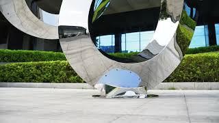 sculpture0755.com, Large outdoor stainless steel streamer sculpture: dynamic beauty in space