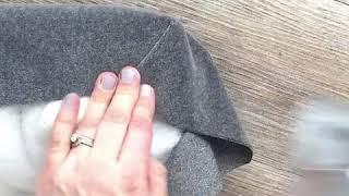 Stapling a fabric corner on a DIY Upholstered Headboard