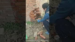 Process of Repairing Red Brick Corner of a Rural Courtyard Wall