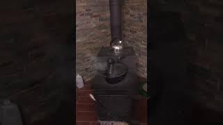 Cast Iron Dragon Steamer Pot on a Wood Stove