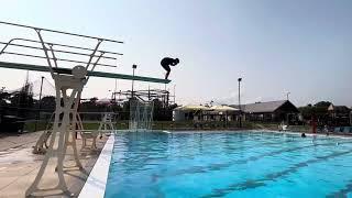 Wesley jumps off of the high dive