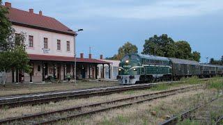 Green Hungarian Komplex Rail M61 stops with its fast train in Sümeg