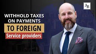 When does a US company have to withhold taxes on payments to foreign service providers?