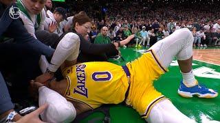 Russell Westbrook almost crashes his head into a cameraman after a hard foul on him in a fast break