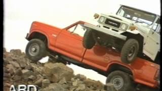 Ford F350 carrying a Toyota LandCruiser uphill - TV Commercial