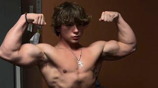 17 years old teen boy flexing muscle