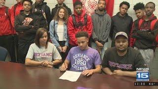 Elijah Holmes of North Side signs with Defiance College basketball on 5/4/17