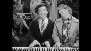 11 Le Salon de la Musique Harpo and Chico Marx playin