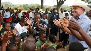 Celebration in Zimbabwe as a white farmer returns to seized land