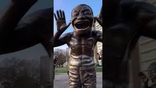 A-maze-ing Laughter; Bronze figures at English Bay in Vancouver BC. Artist, Yue Minjun