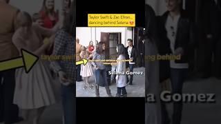 Taylor Swift and Zac Efron dancing behind Selena Gomez  #selenagomez #taylorswift