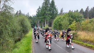 Return march of Lonach Highlanders through Cairngorms Park during 2024 Lonach Gathering in Scotland