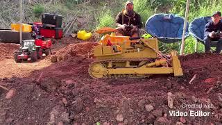 Shifting muck with RC earthmoving equipment