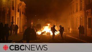 Protests erupt in Paris after government pushes through pension reform