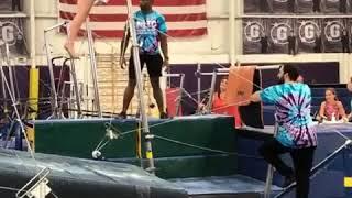 Gymnastics Coach Rolls Over Uneven Bars and Falls While Helping a Girl - 1064389