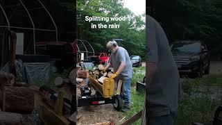 Splitting wood in the rain.