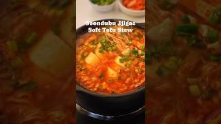 Soondubu Jjigae or Korean Soft Tofu Soup is a bowl of comfort simmered in savory and spicy broth.