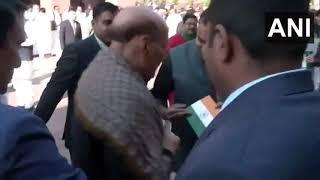 LoP Lok Sabha, Rahul Gandhi gives a Rose flower and Tiranga to Defence Minister Rajnath Singh