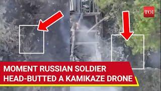 Russian Soldier Head-butts Ukrainian Kamikaze Drone, Then Emerges Like 'Zombie' From Smoke | Watch