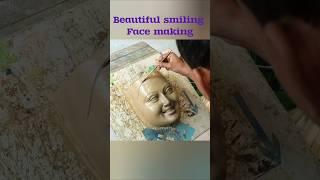 Beautiful smiling face making with clay
