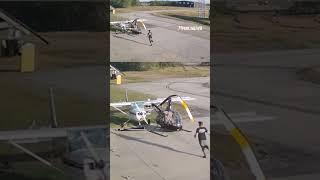 Helicopter spins out of control and crashes into parked plane