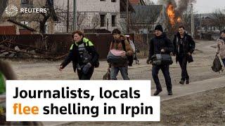 Journalists, locals flee heavy shelling in Ukraine's Irpin