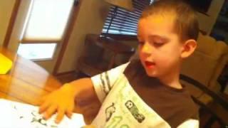 Peyton reads his book.