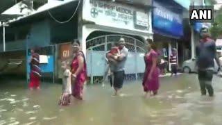 Assam floods: People use boats to commute  on flooded streets in Dhubri