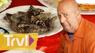 Eating Fried Snake Skin & Beating Snake Heart | Bizarre Foods with Andrew Zimmern | Travel Channel