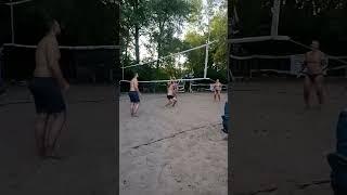 Beach volleyball, a strong pass of the ball to a distant player.