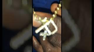 RealOgIceMan flexing Traxnyc Diamond P And Vs Diamond cross pendant